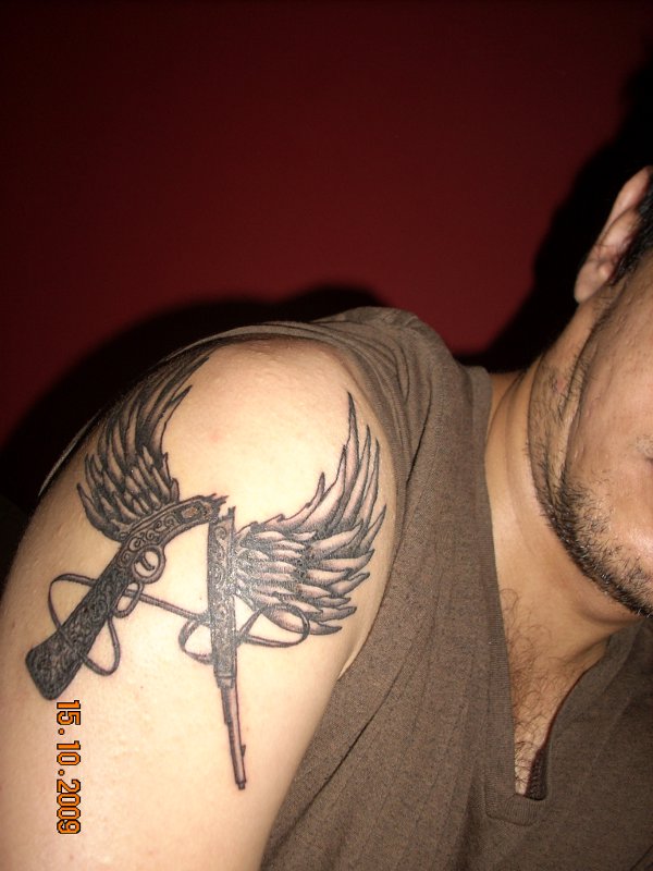 Abhishek - Winged rifle A tattoo