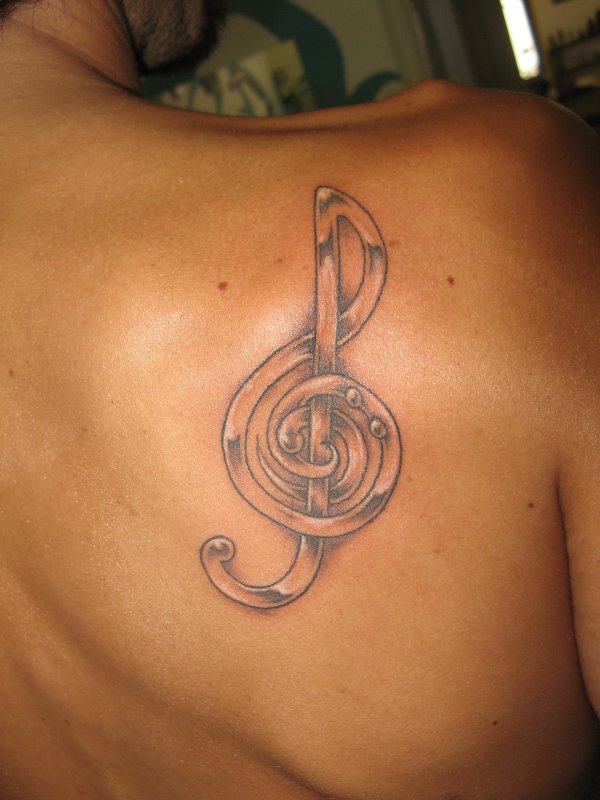 Nunzio - Musical clefs tattoo