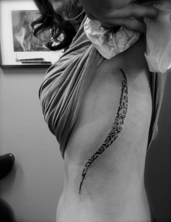 Tanne - ribcage tattoo photo